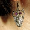 owl earring with purple eyes